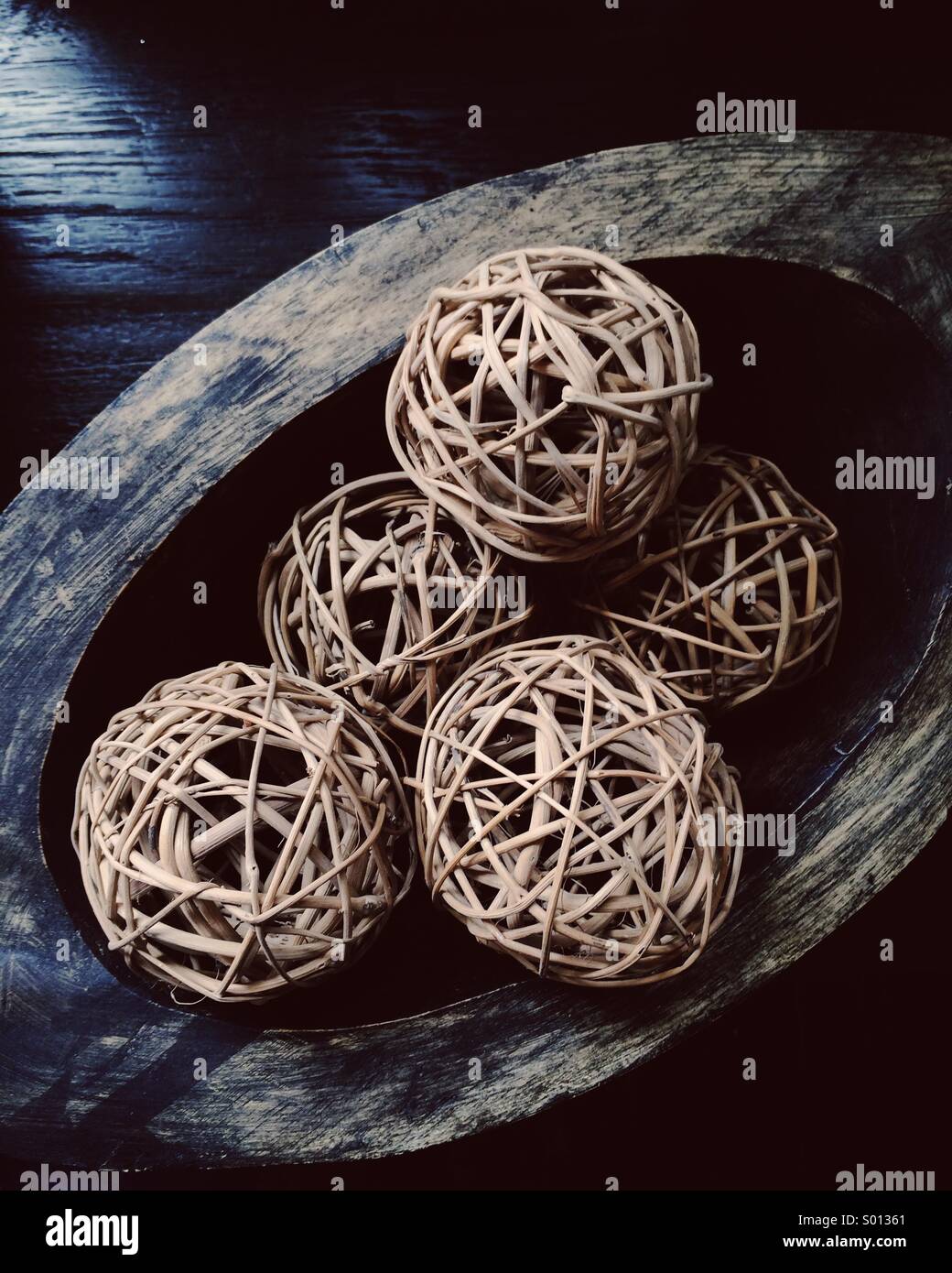 Rustic woven balls in wooden dish Stock Photo Alamy