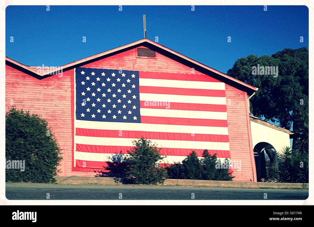 American Flag painted on house Stock Photo - Alamy