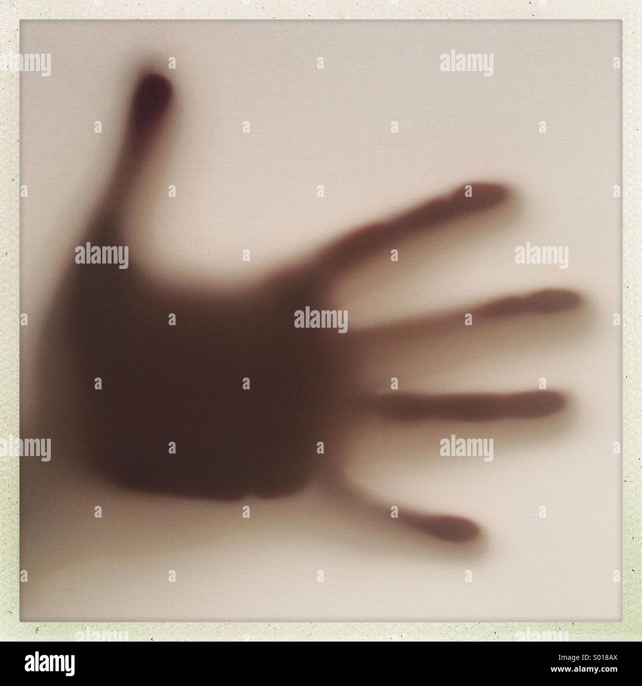 Hand silhoutte on window - Smartphone Captured Stock Image