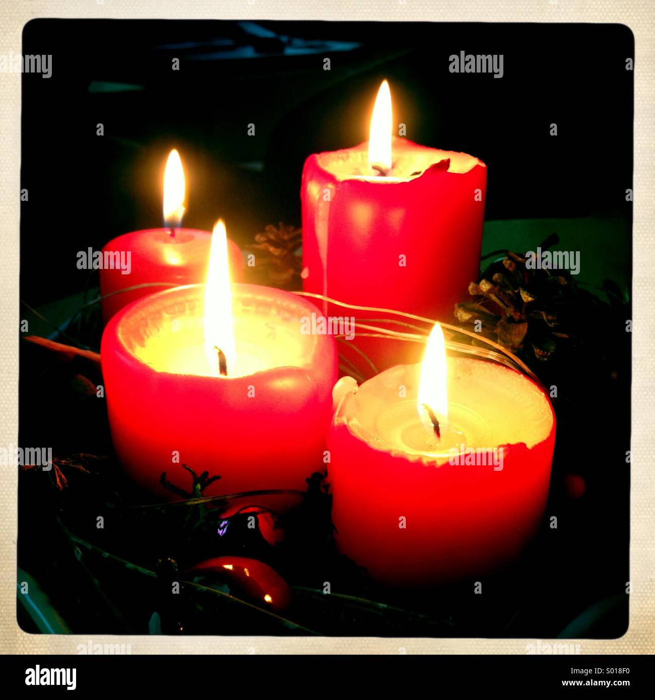 Four red burning candles - Smartphone Captured Stock Image