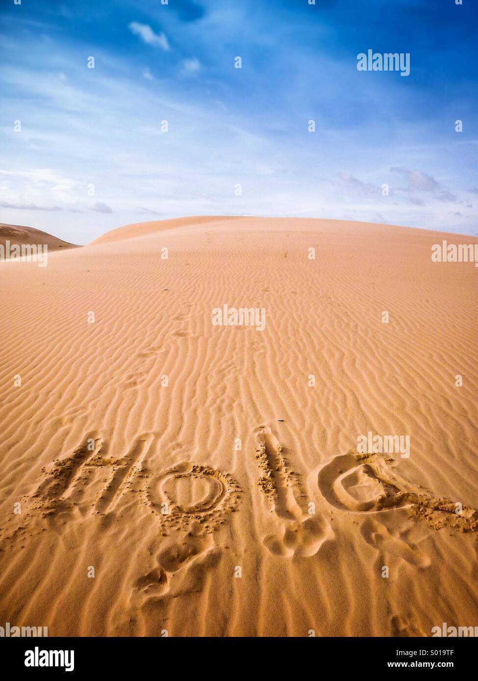 Hola greetings sand dune Stock Photo