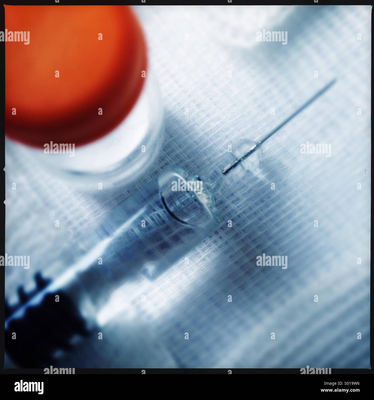 Medical syringe and vaccine on gauze dressing - Smartphone Captured Stock Image