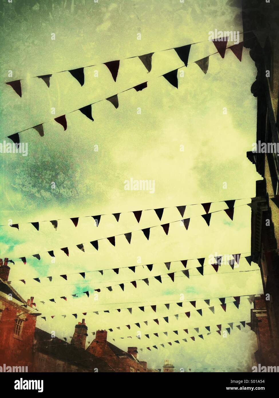 Bunting in a street scene with a grunge effect. - Smartphone Captured Stock Image