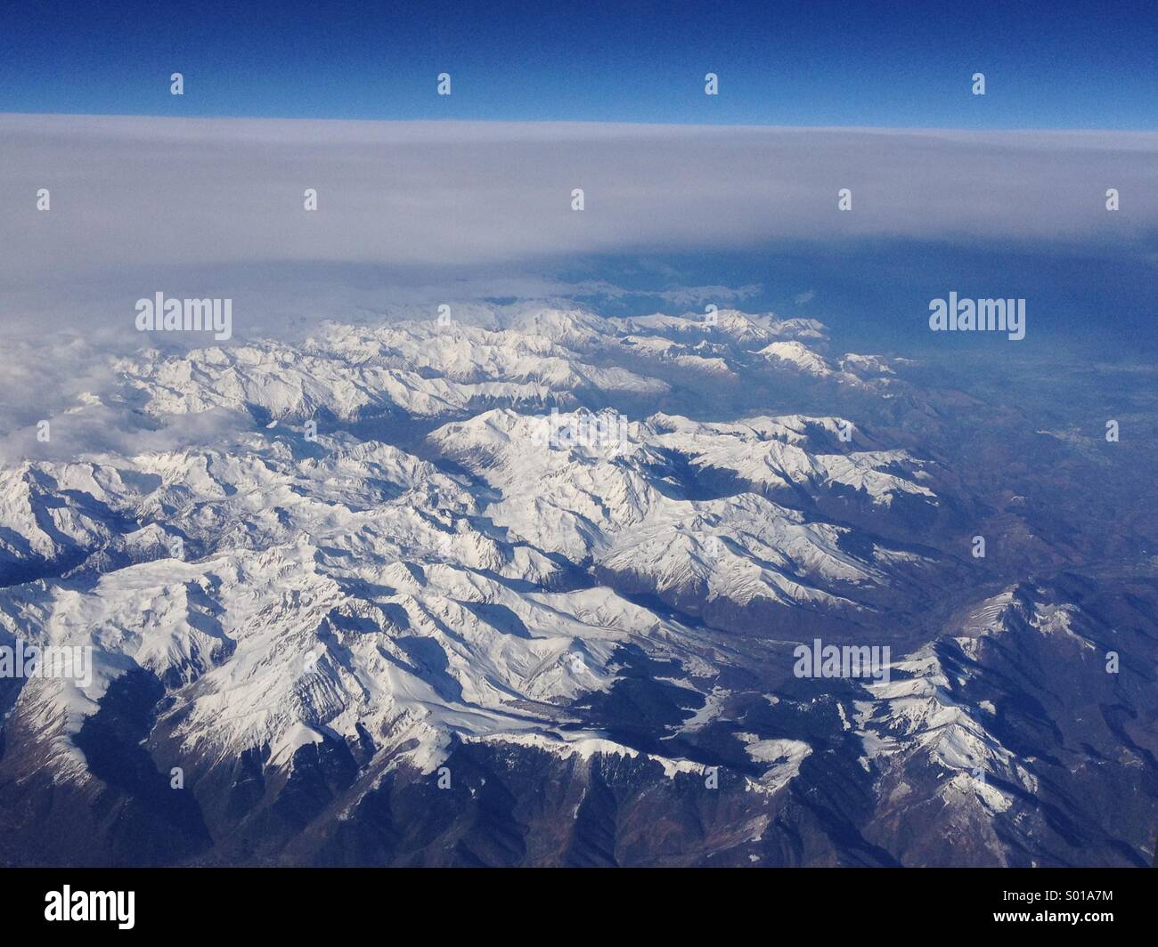 Aerial view of snow covered Pyrenees mountains, from an aeroplane at about 35,000 ft. - Smartphone Captured Stock Image