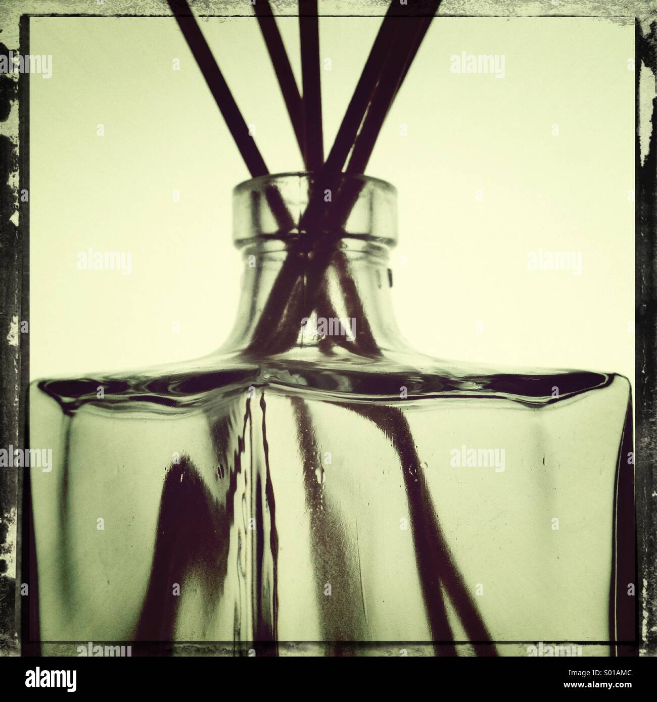 Room fragrance bottle and sticks - Smartphone Captured Stock Image