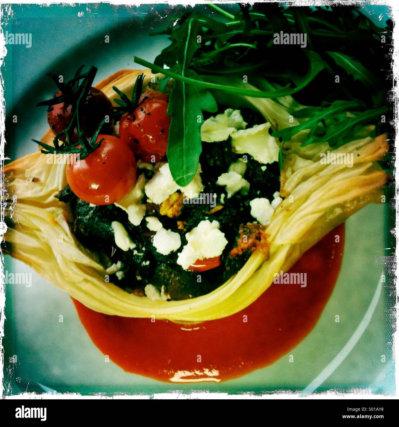 Wild mushroom cherry tomatoes and goat cheese crispy filo tart on a