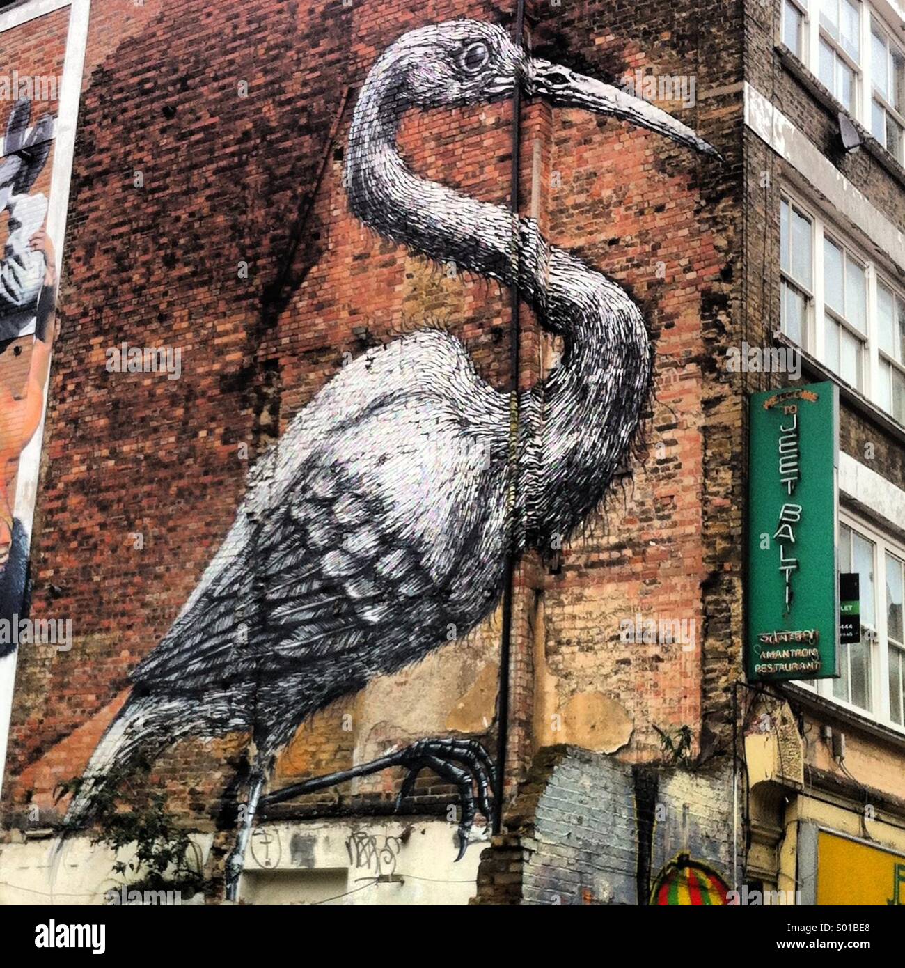 Street art graffiti crane London Stock Photo
