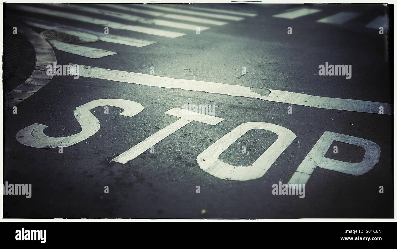 Stop sign on asphalt Stock Photo