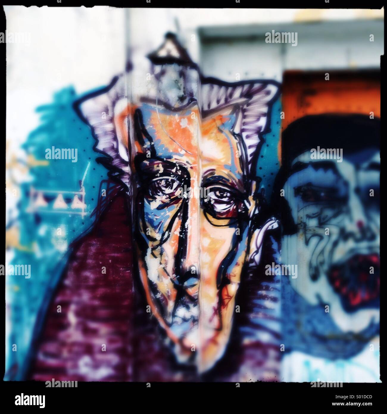Depressive face graffitti art at istanbul street - Smartphone Captured Stock Image