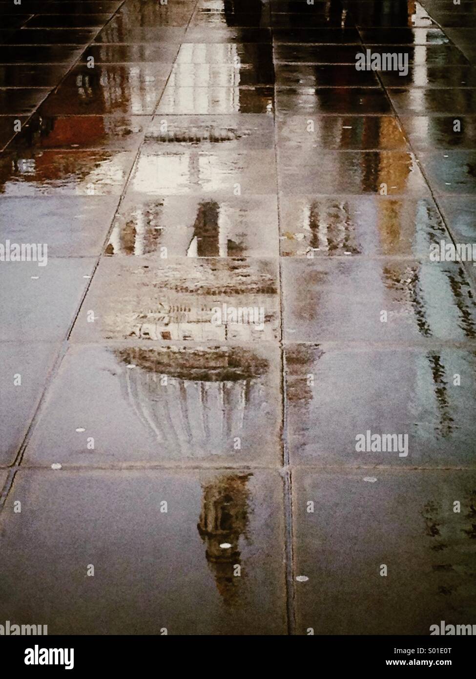 A reflection in puddles of St Paul's Cathedral on a rainy day in London - Smartphone Captured Stock Image