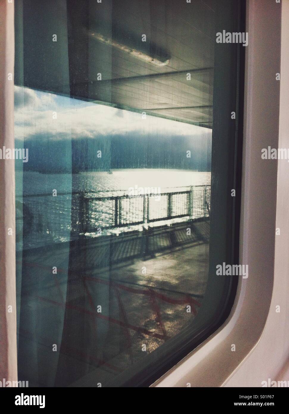 Reflection of ocean in ferry ship window, Strait or Georgia, British Columbia, Canada. - Smartphone Captured Stock Image