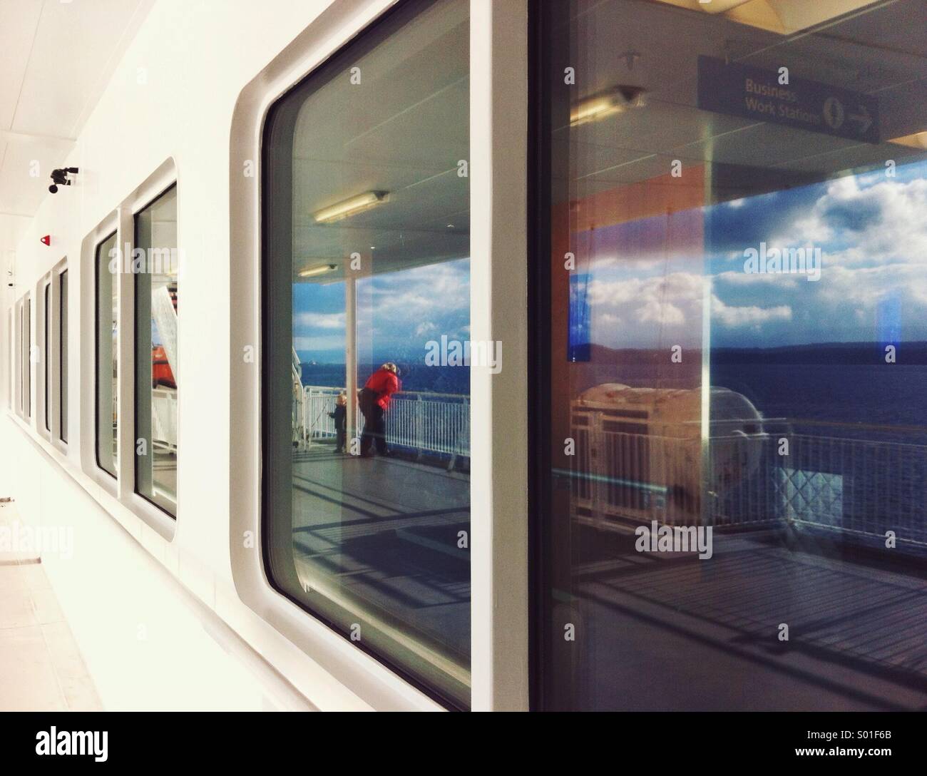 Reflection of ocean and people in window of ferry boat, Strait of Georgia, British Columbia, Canada. - Smartphone Captured Stock Image