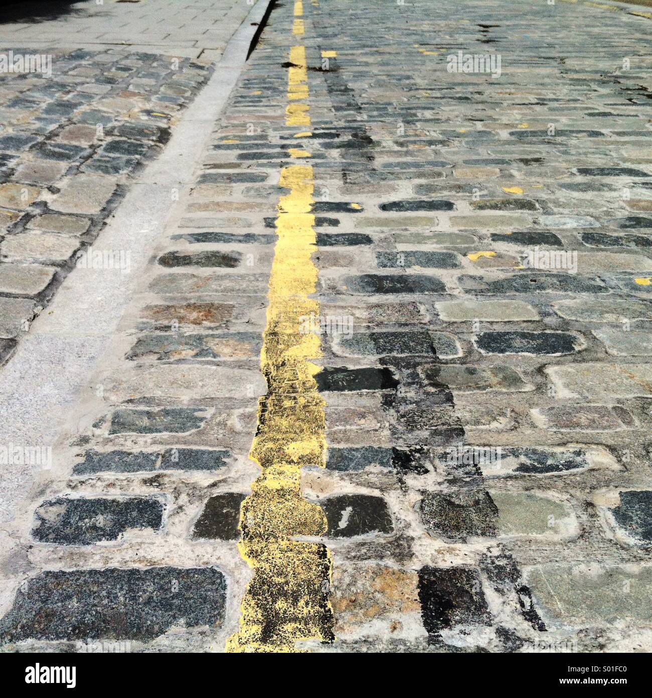 Single yellow line on a London road Stock Photo Alamy