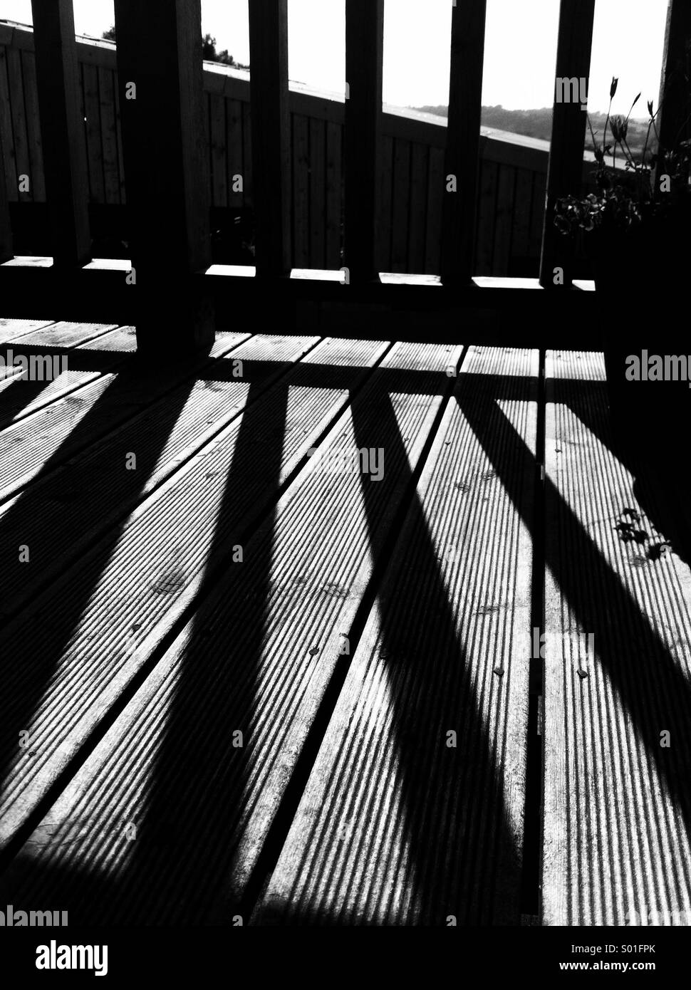 Shadows on decking Stock Photo