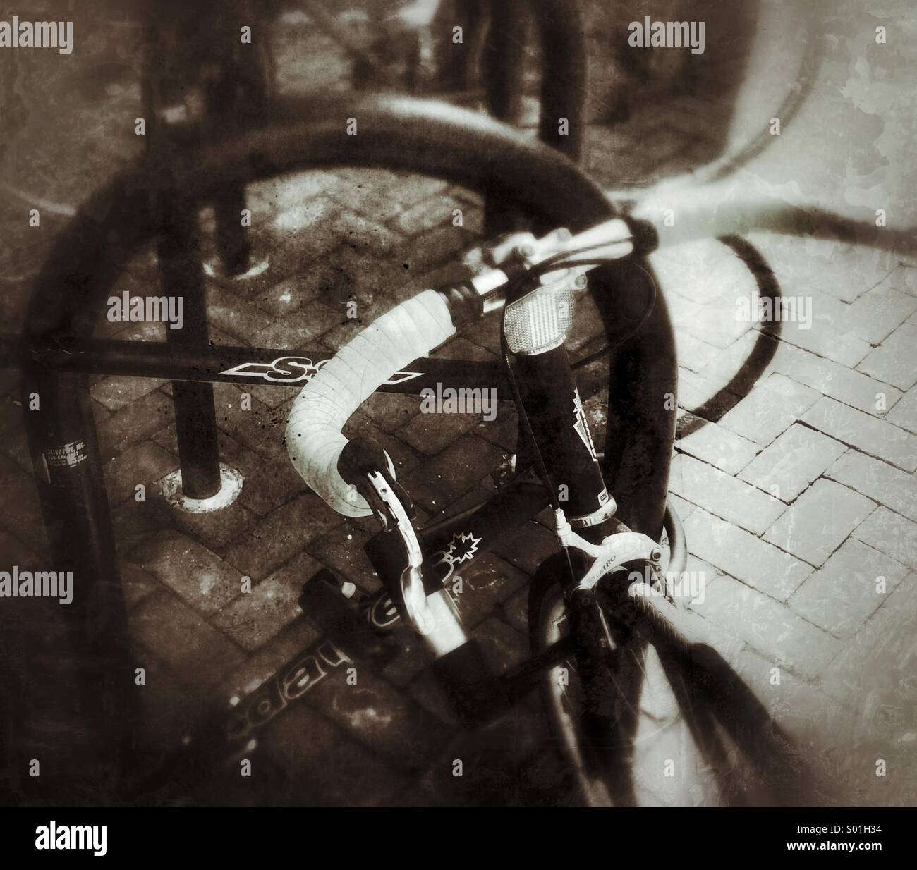 A bike locked to a bike rack Stock Photo Alamy