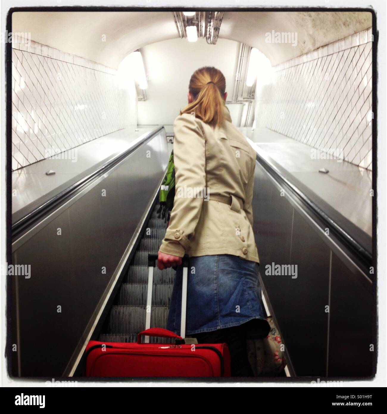 A woman on the Paris metro with luggage Stock Photo Alamy
