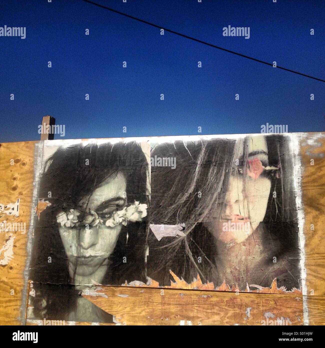 Model pictures decorate a wall in Parque Mexico, Colonia Condesa, Mexico City, Mexico - Smartphone Captured Stock Image