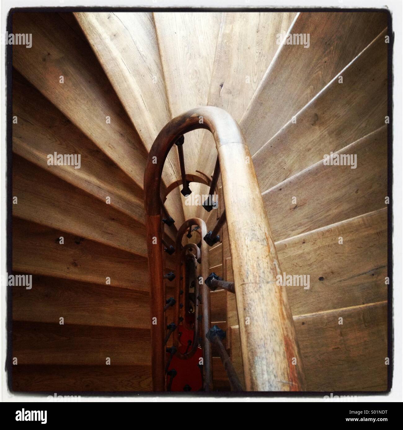 A curvy wooden staircase - Smartphone Captured Stock Image