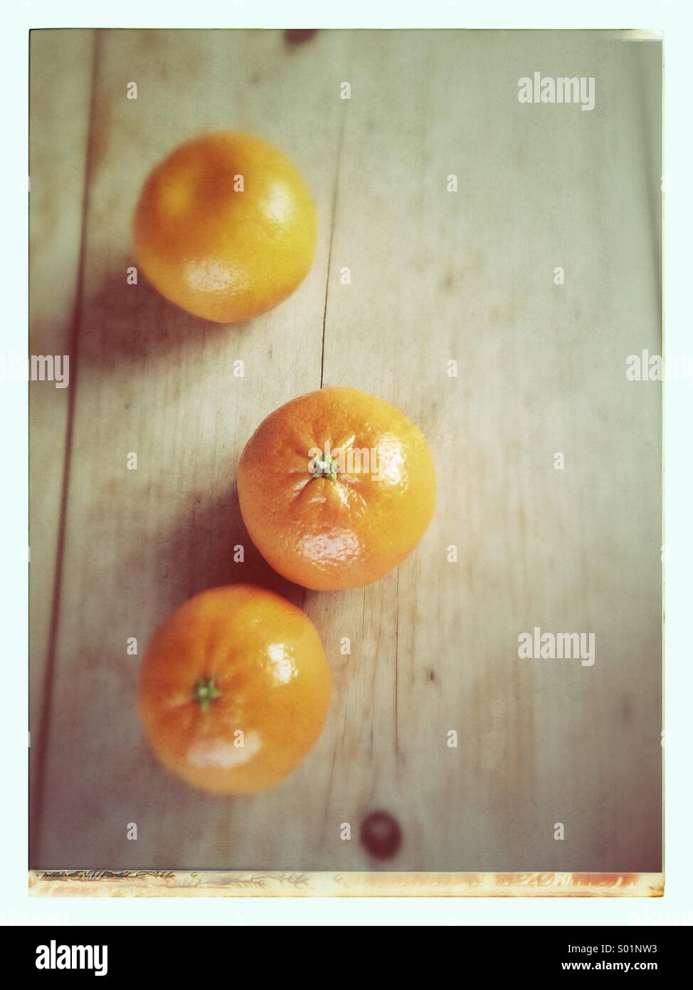 Three clementines Stock Photo