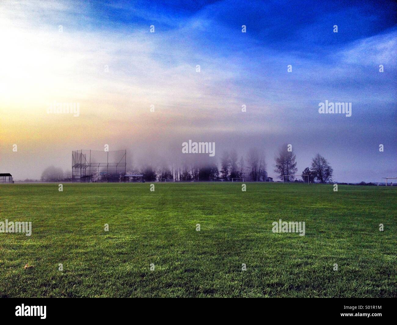 Sports field engrossed in fog. - Smartphone Captured Stock Image