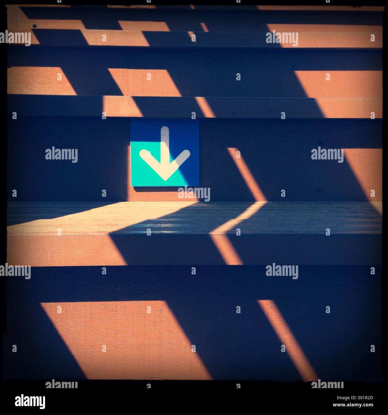 Arrow sign on stairs - Smartphone Captured Stock Image