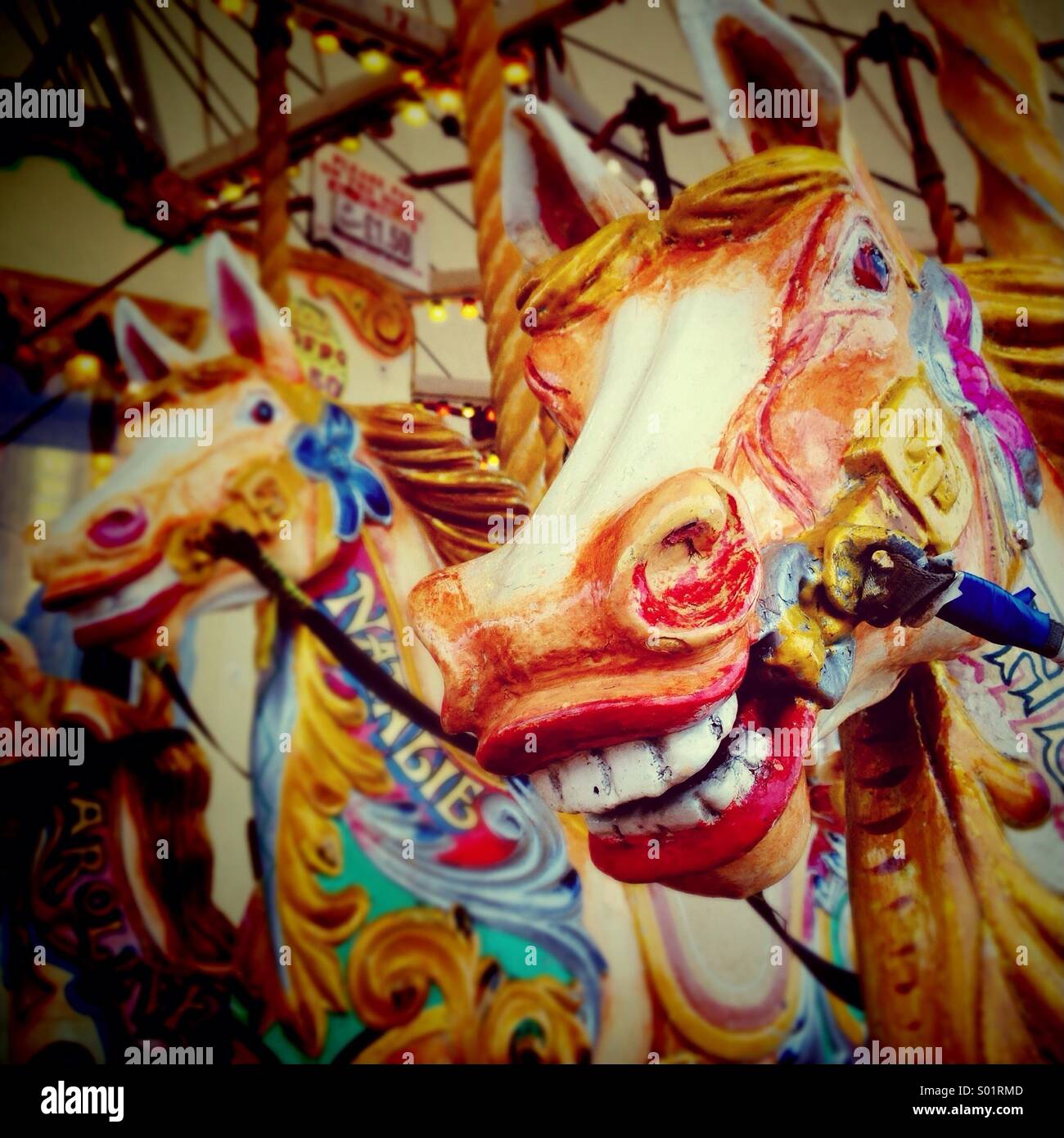 Carved colourful horses on carousel on Southport promenade Stock Photo