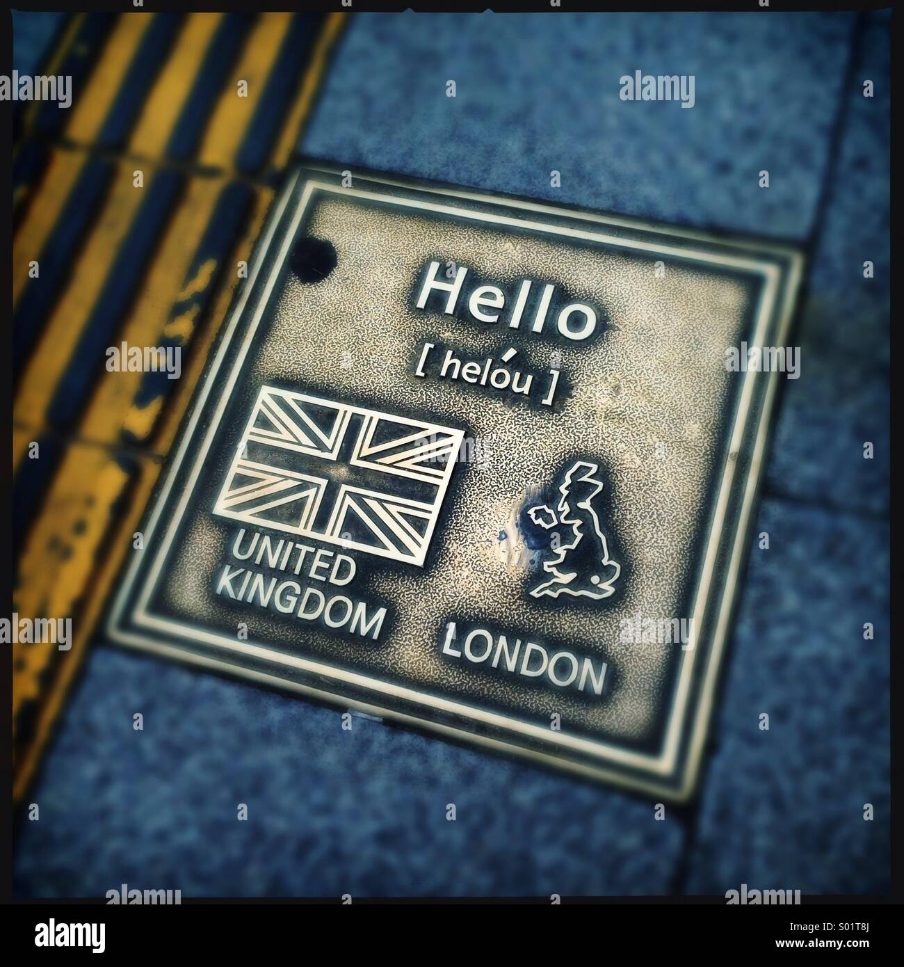 Brass plate on sidewalk showing hello, korea Stock Photo Alamy
