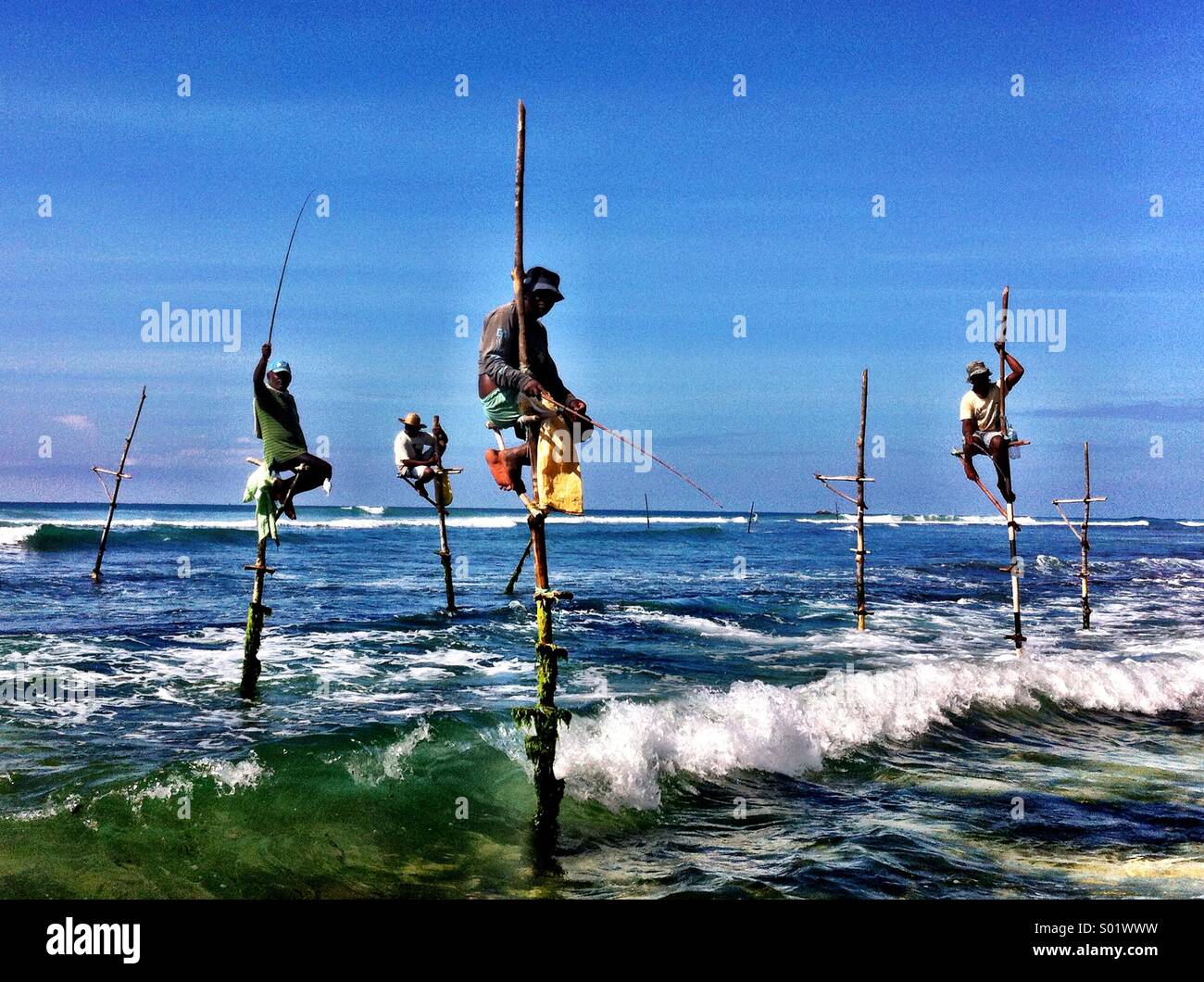 Fishermen ocean sticks hi-res stock photography and images - Alamy