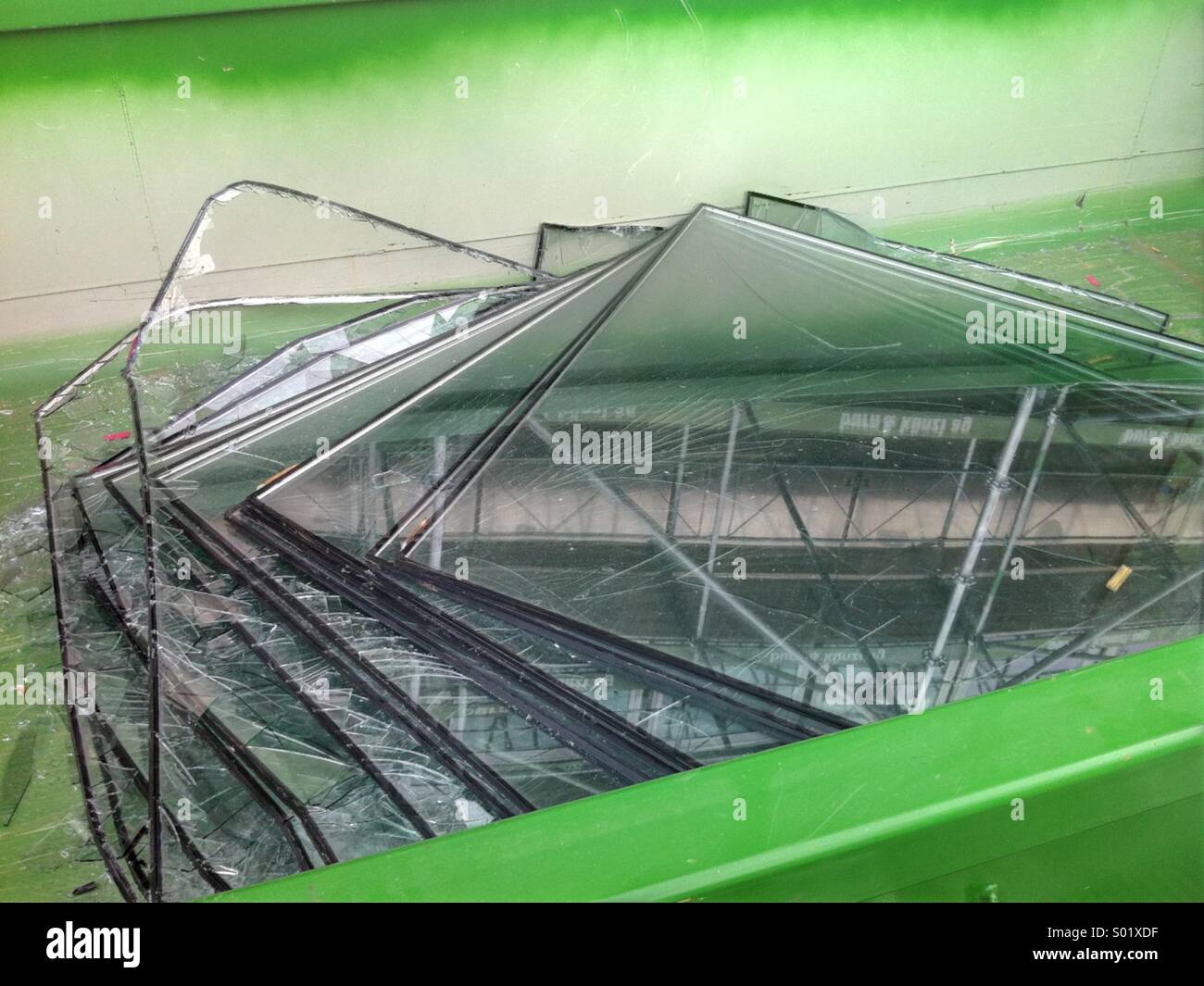 Old window panes in a skip - Smartphone Captured Stock Image