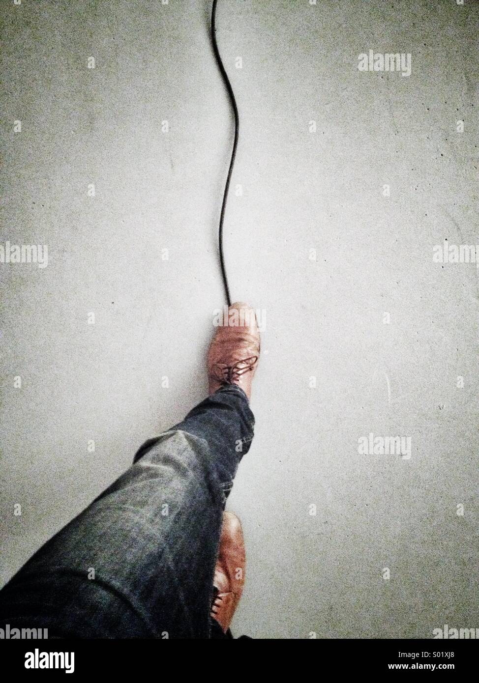 Balancing on cable Stock Photo