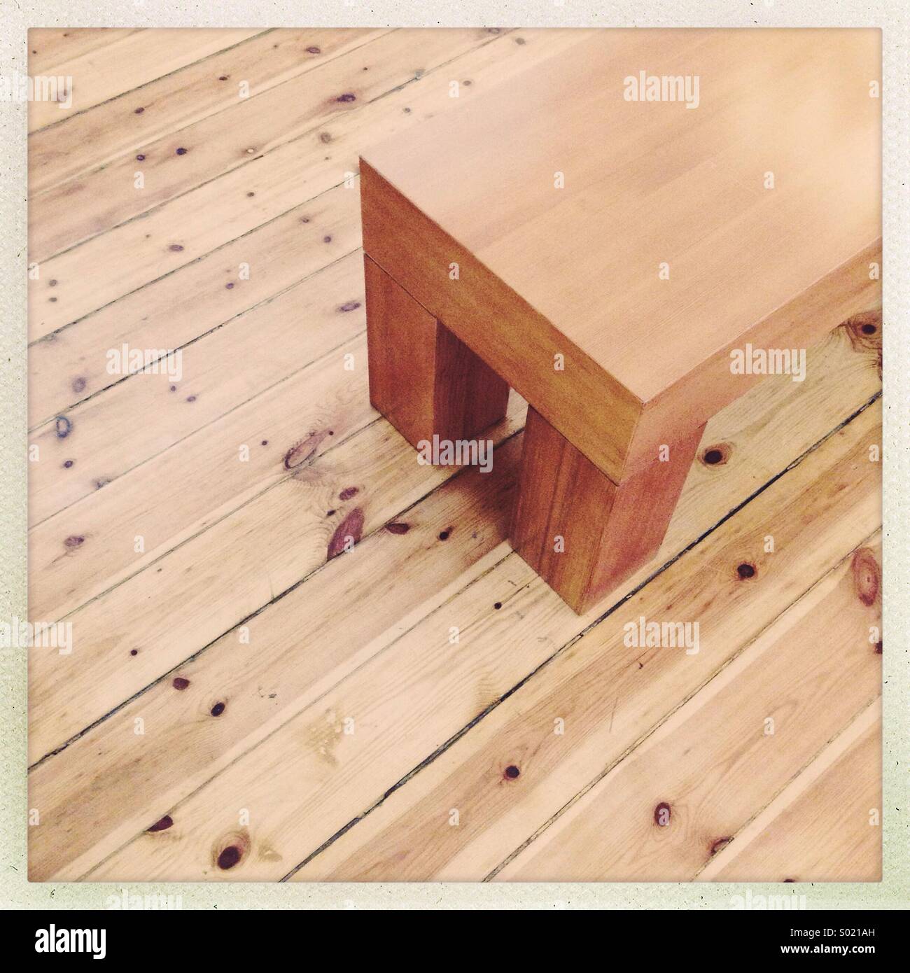 A desk on wooden floor - Smartphone Captured Stock Image