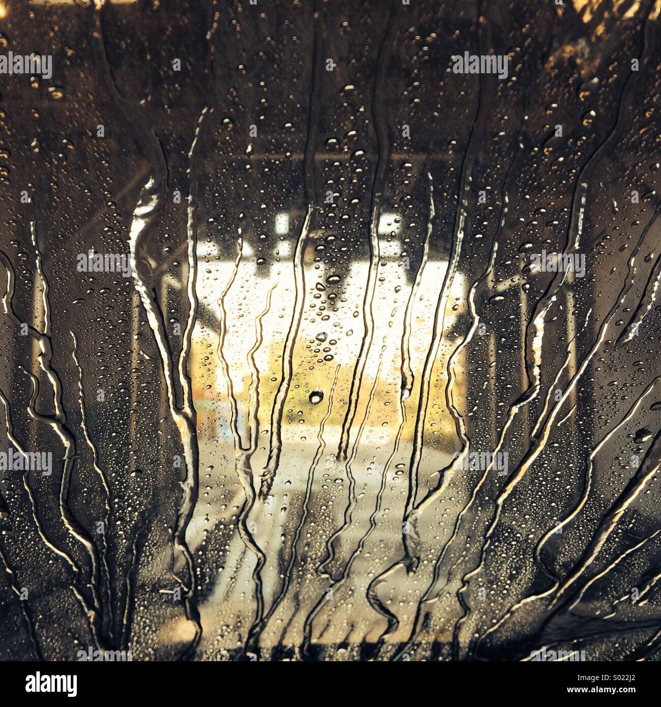 Going through the car wash - water on the screen - Smartphone Captured Stock Image