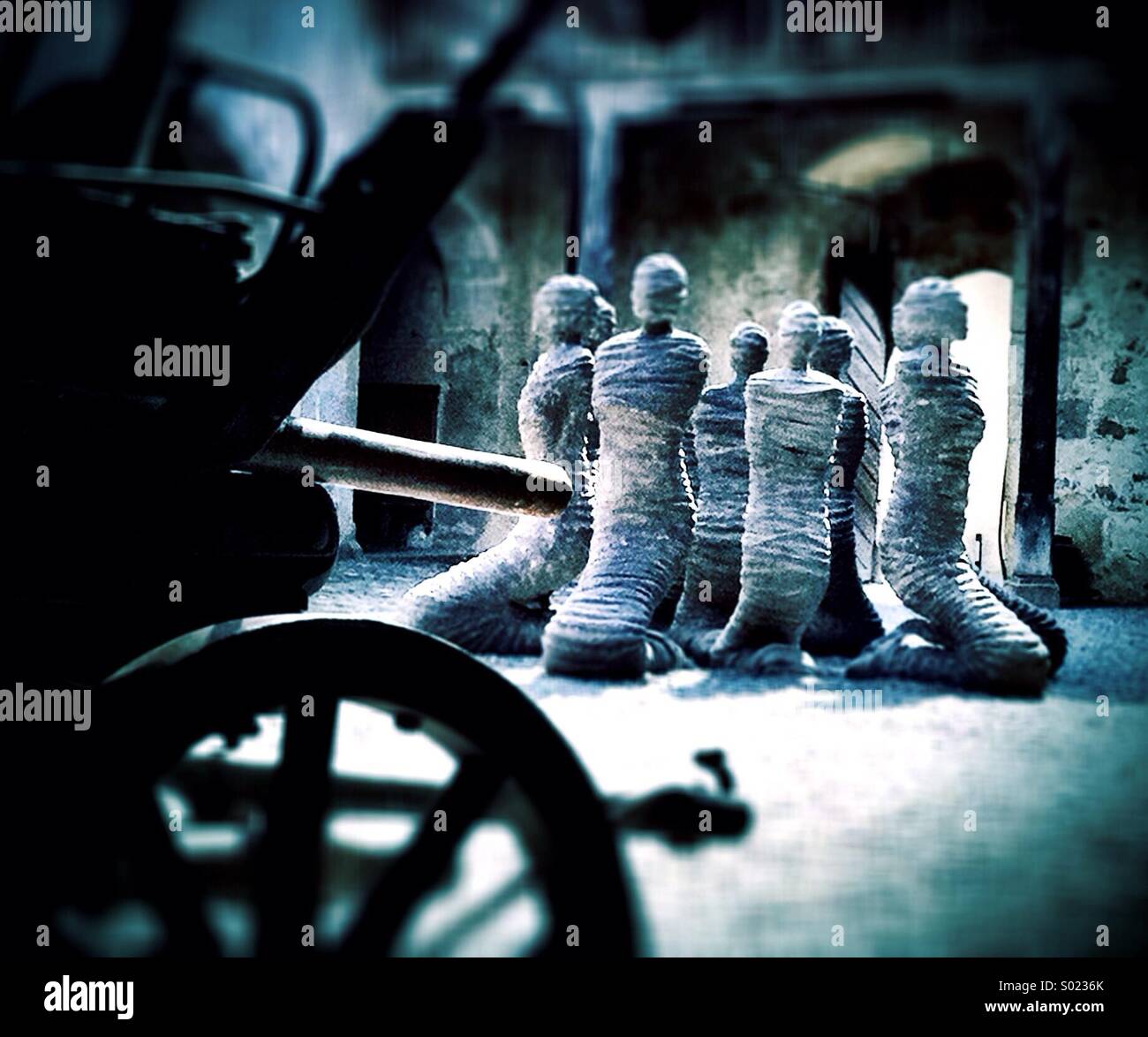 Hostages - poignant sculptures by Carl Bucher in courtyard of Gruyères Castle, Switzerland - Smartphone Captured Stock Image