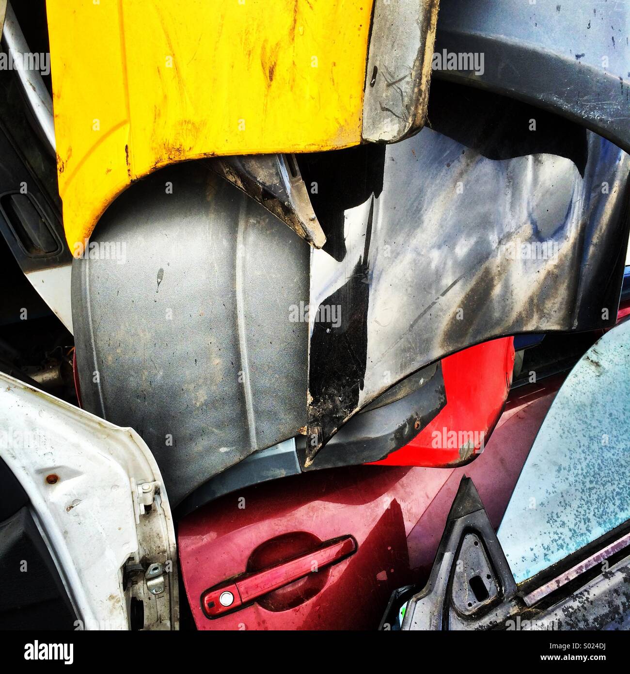 Stacked secondhand car doors at a scrapyard. - Smartphone Captured Stock Image