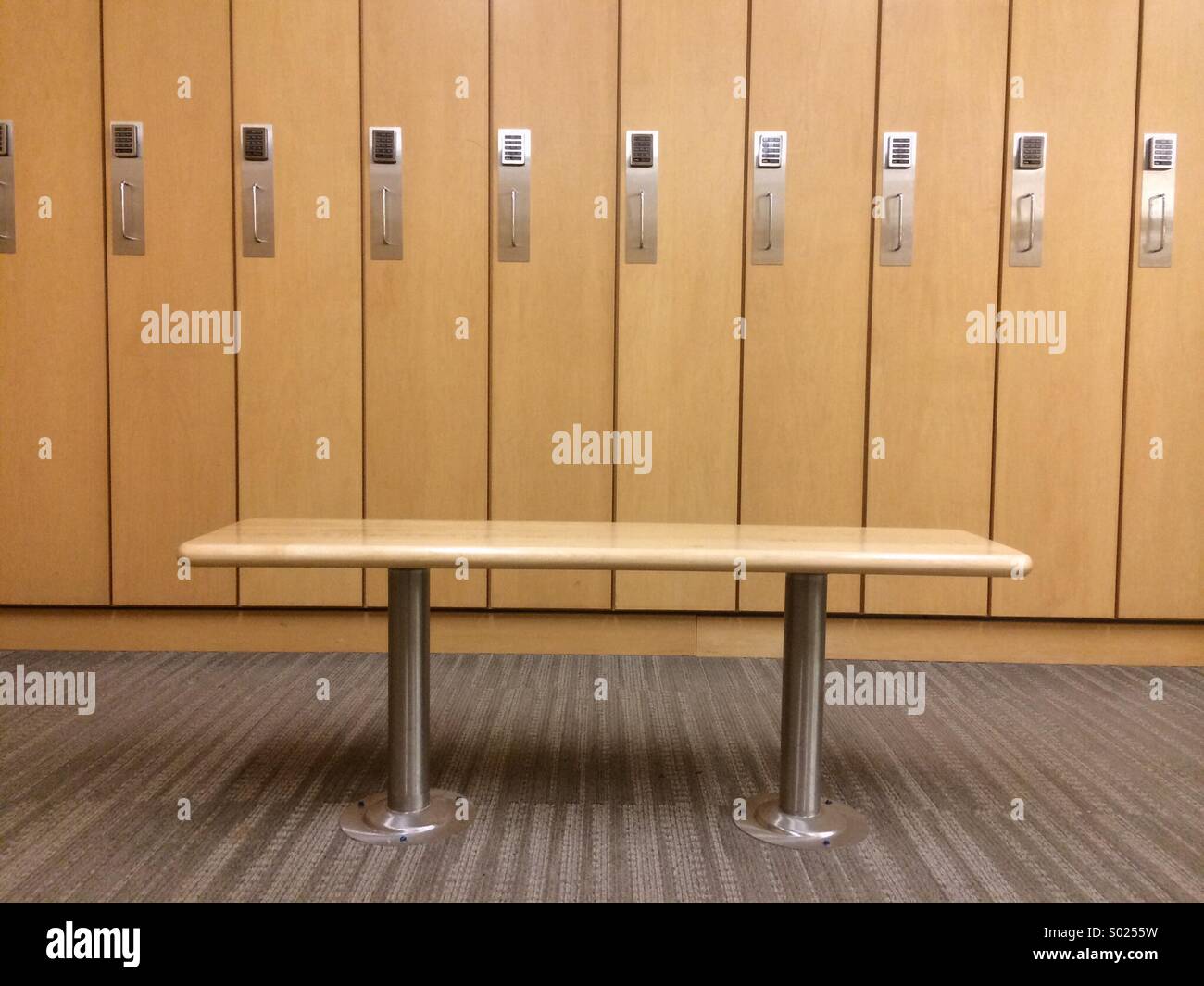 Bench and lockers in a fitness facility Stock Photo Alamy