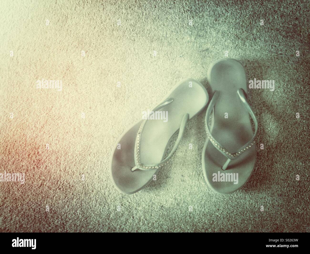 Pair of worn womens flip-flop shoe with grunge effect. - Smartphone Captured Stock Image