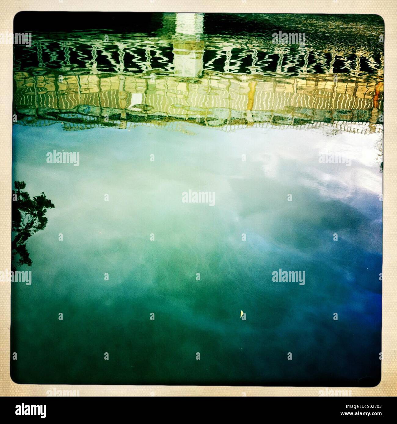 Bridge reflection in water Stock Photo