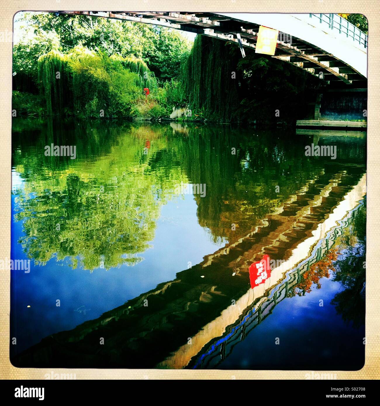Bridge reflection in river Stock Photo