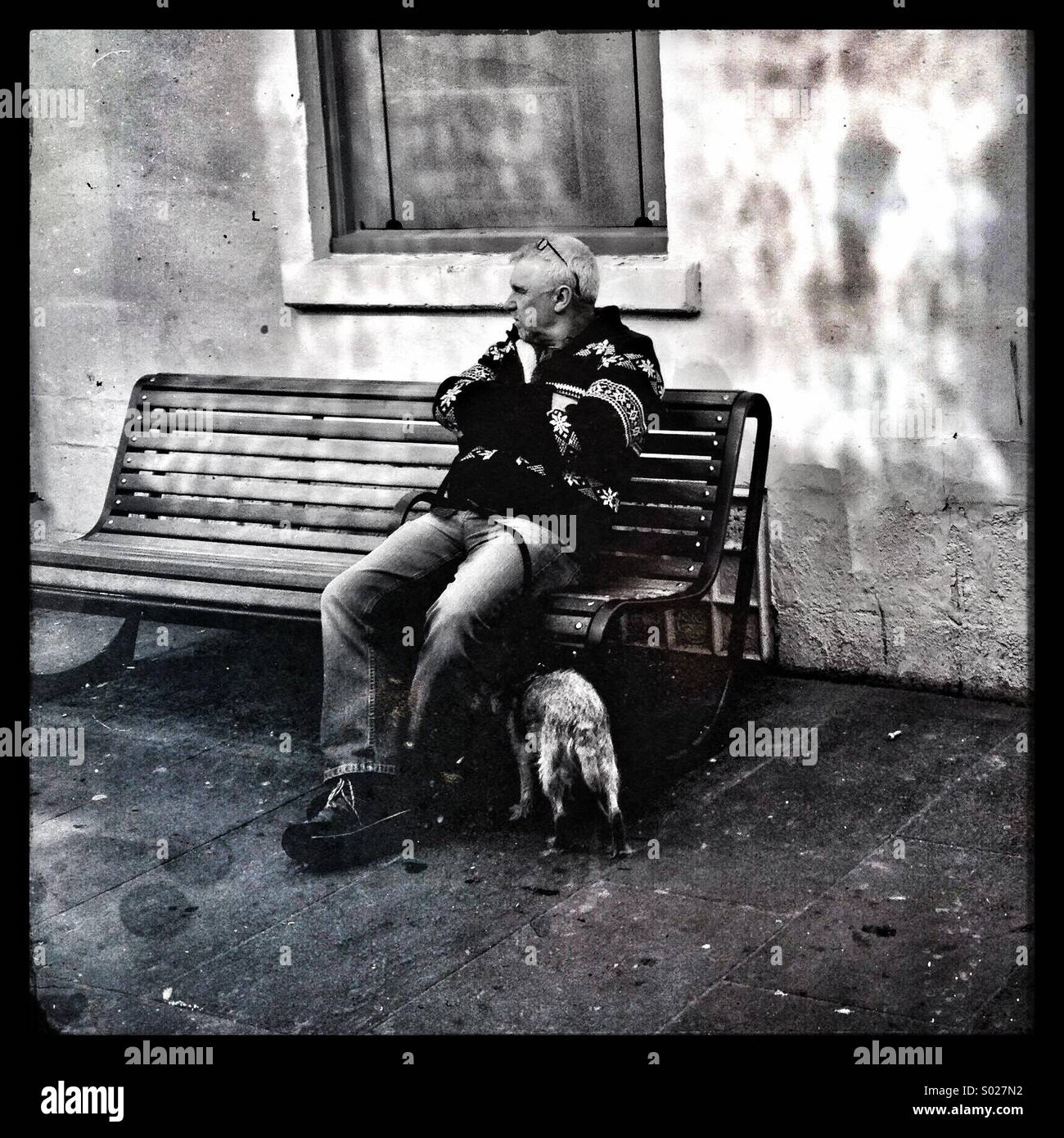 Man sitting, looking - Smartphone Captured Stock Image