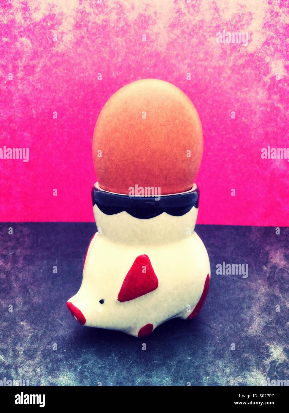 Boiled egg in cute vintage piggy egg cup - Smartphone Captured Stock Image