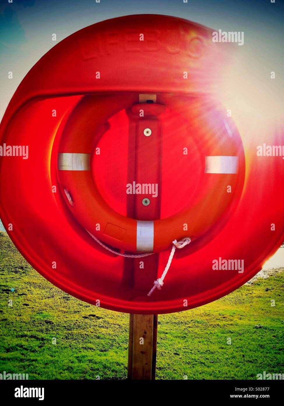 Lifebuoy against sun Stock Photo