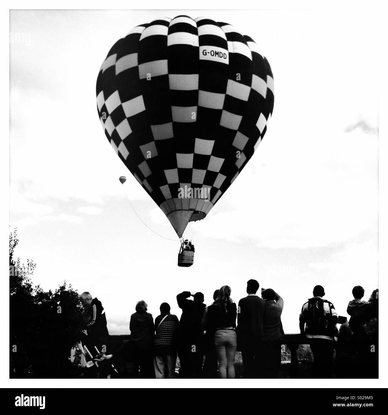 Hot air balloon and spectators (black & white) Stock Photo