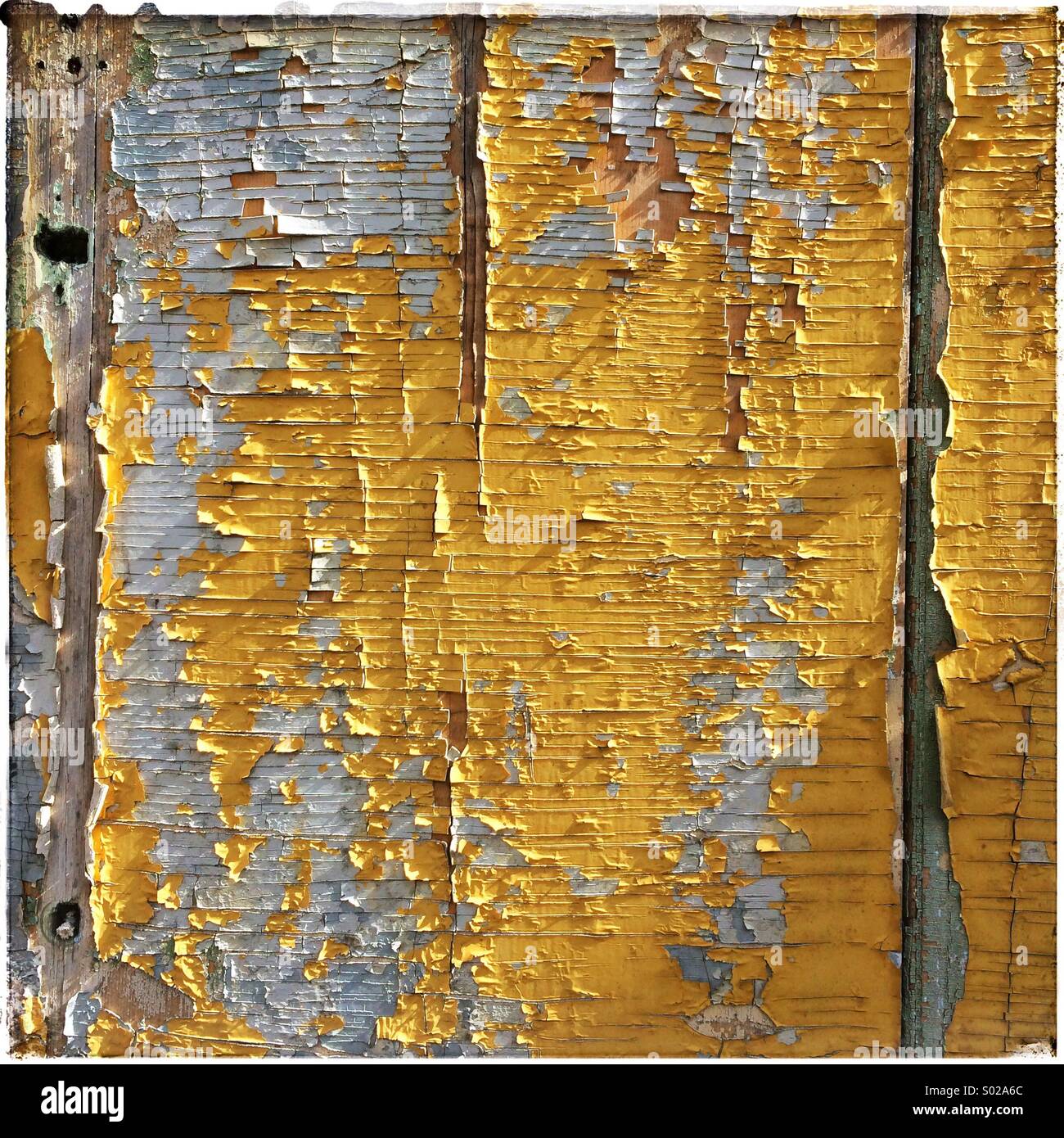 Wooden panel with peeling paint for background Stock Photo