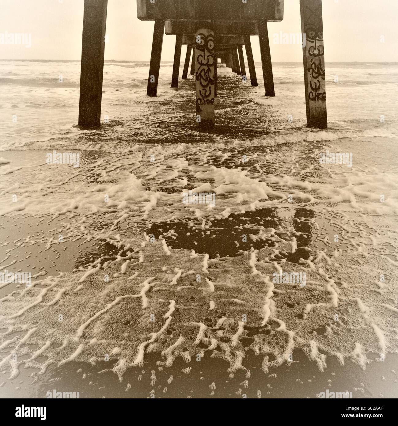 Under Jacksonville Beach Pier on a stormy day - Smartphone Captured Stock Image