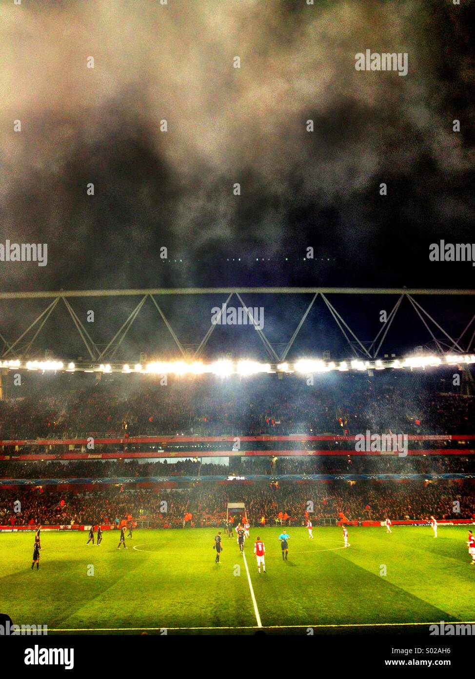 Smoke in the sky over the Emirates stadium Stock Photo