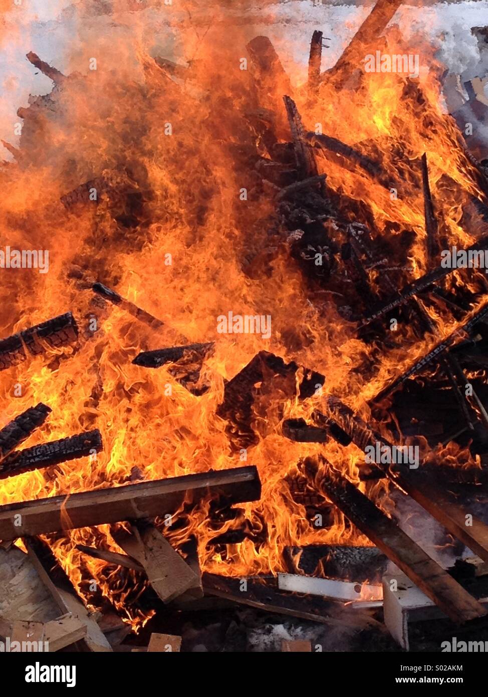 Burn pile of waste construction material Stock Photo