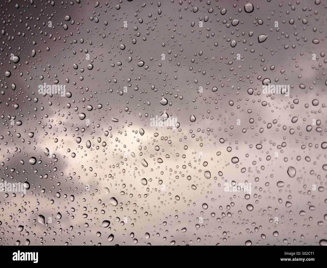 Rain glistening on a window Stock Photo