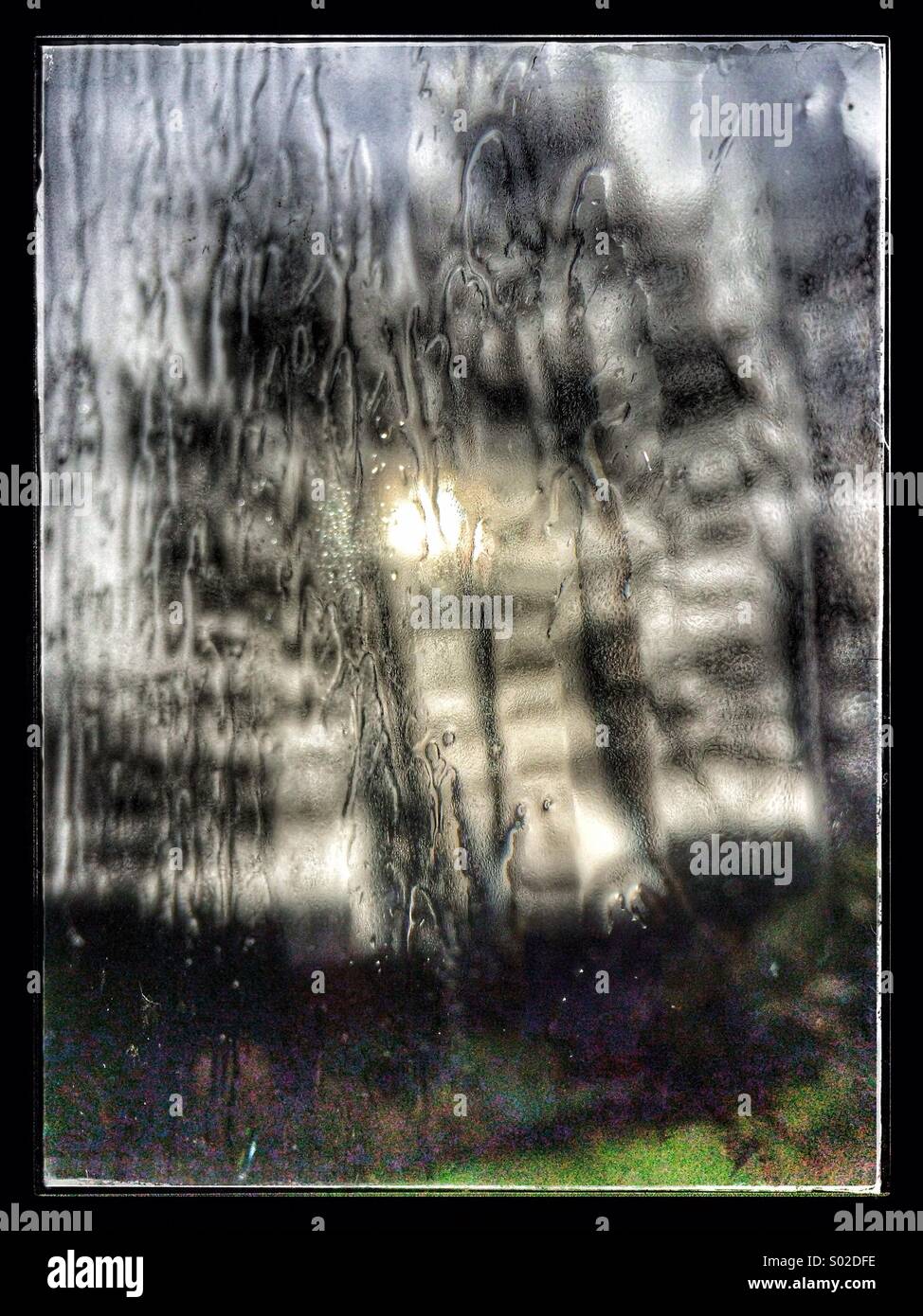 Rain water running down window during Storm Stock Photo