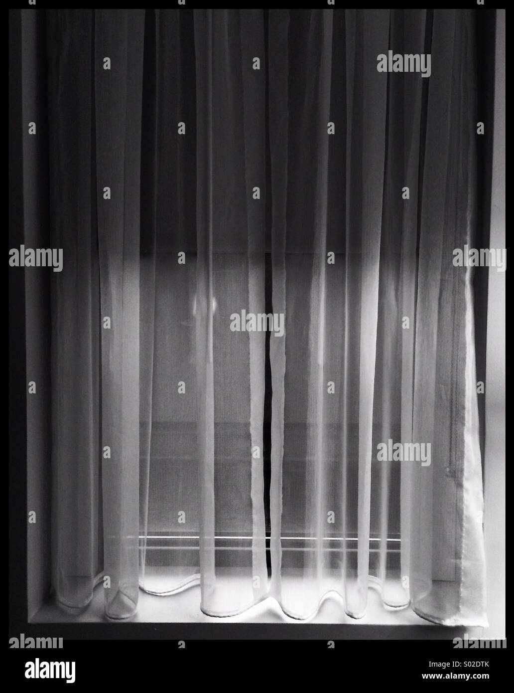 Black and white window with curtain - Smartphone Captured Stock Image