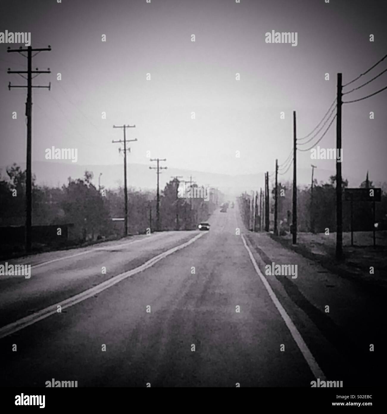 Telephone poles long road - Smartphone Captured Stock Image
